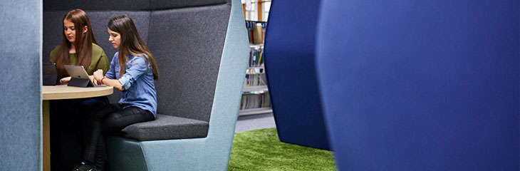 students sitting inside the library