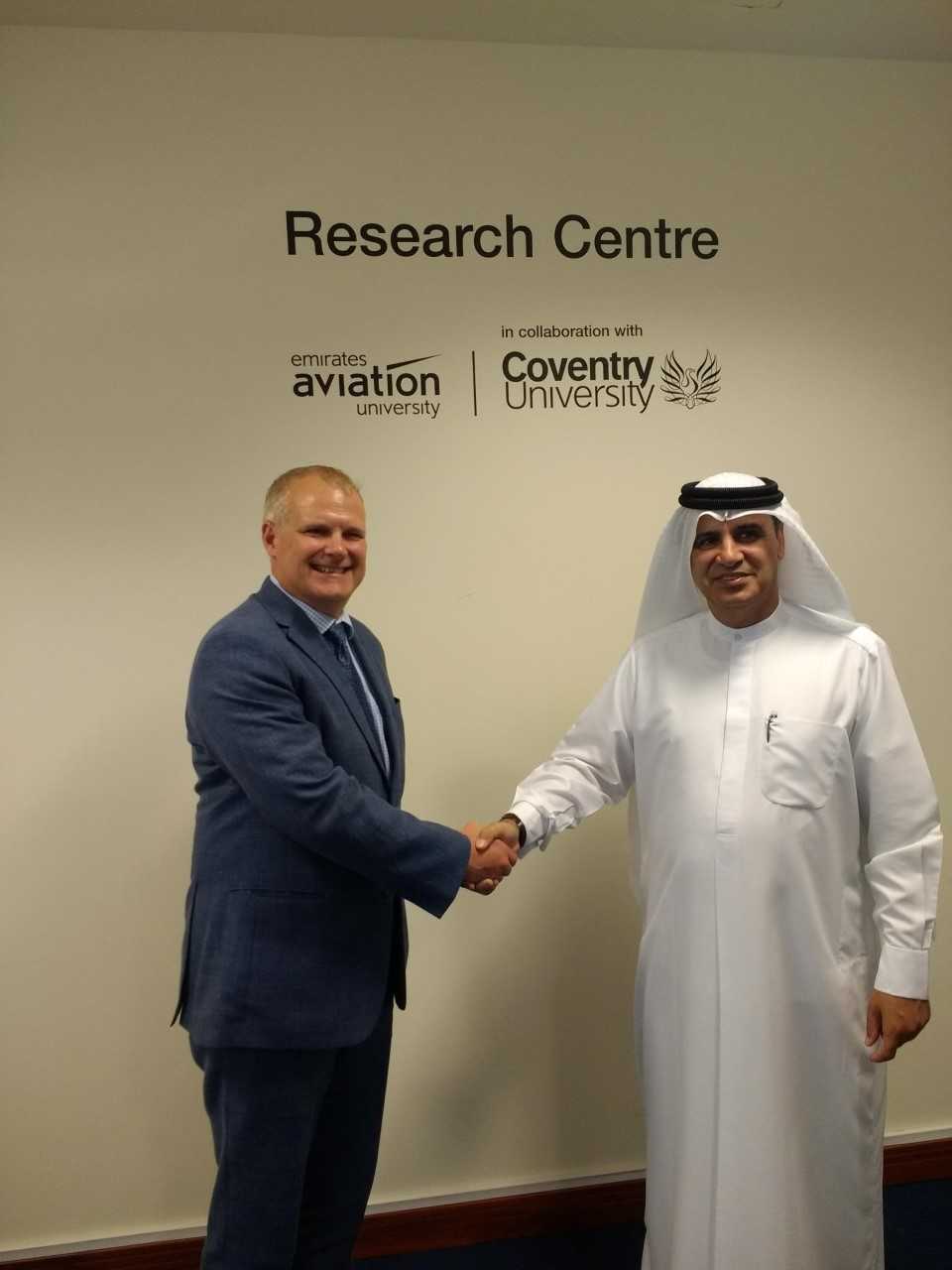 Richard Dashwood and Dr Ahmad Al Ali shaking hands