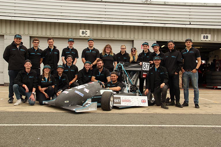 The Phoenix Racing team with their car at Silverstone last year.