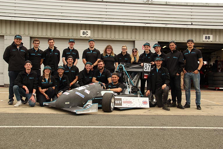 The Phoenix Racing team with their car at Silverstone last year.