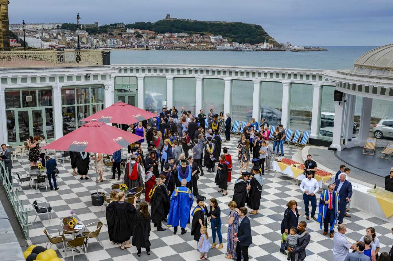 Ariel view of CU Scarborough's graduation celebration with the sea in the background