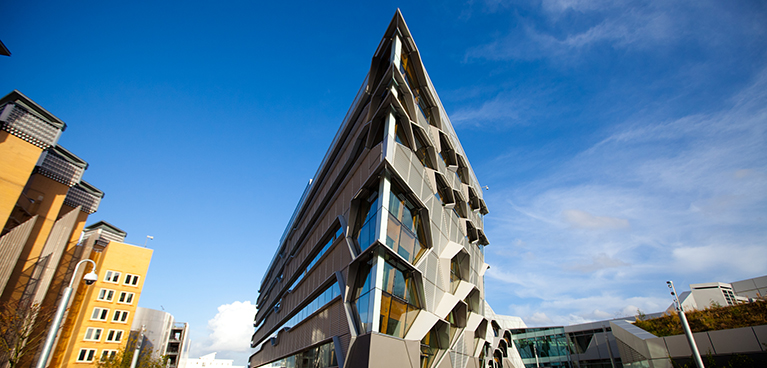 External view of buildings around coventry and a blue sky