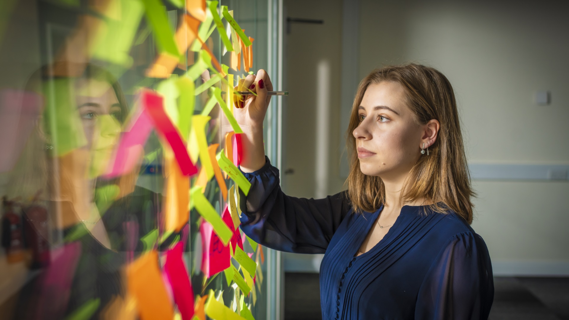 International Entrepreneurship student writing notes on a board