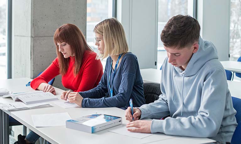 Students workinf at a desk