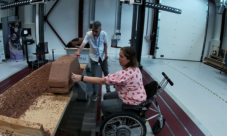 Kay Atkin, PhD student and Paul Herriotts, Professor of Transport Design at Coventry University looking at a clay car model.