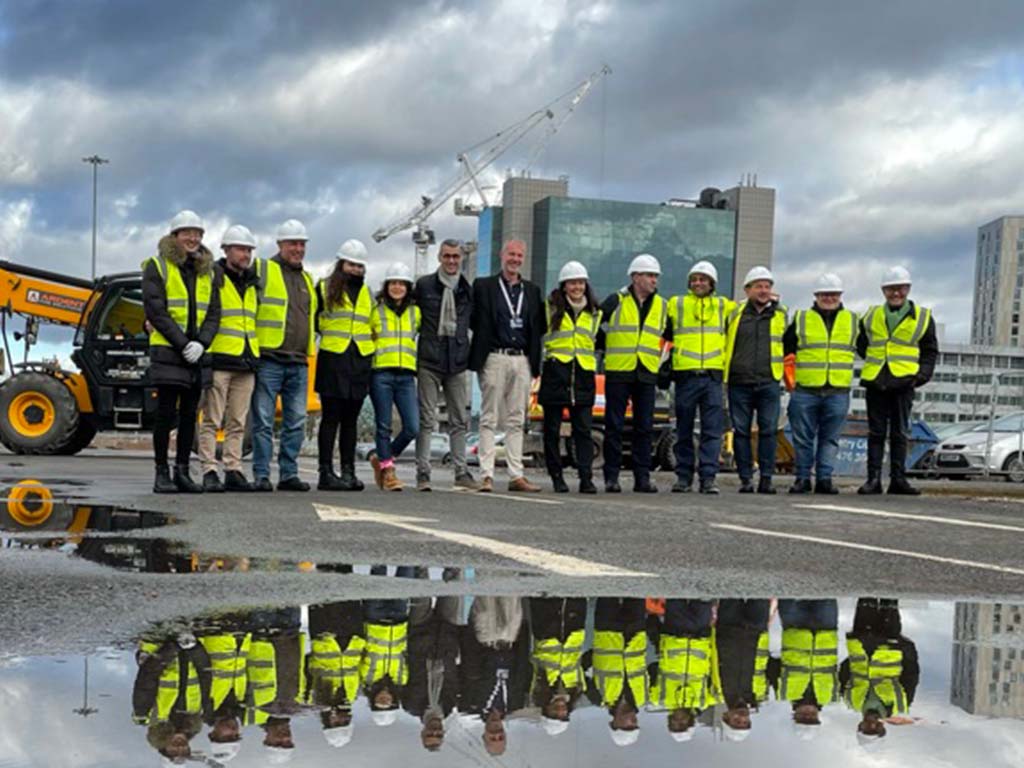 Coventry University and Urban-Air Port colleagues gather on the Air One construction site